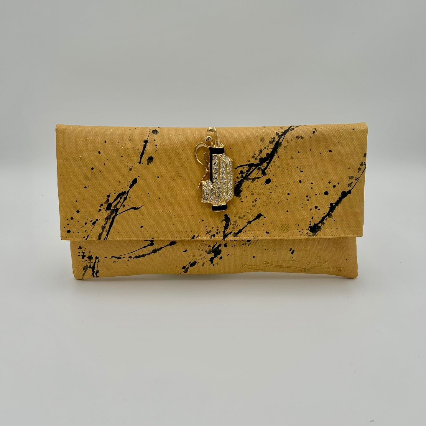 Gold splatter with golf bag