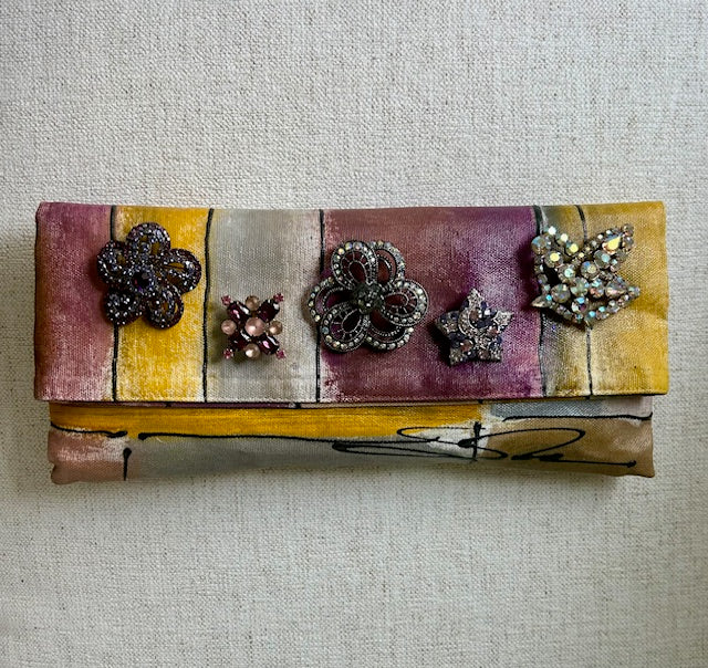 Gemstones on Plum and Bright Gold-stripped Clutch
