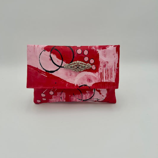 Art Deco brooch on pink and red abstract